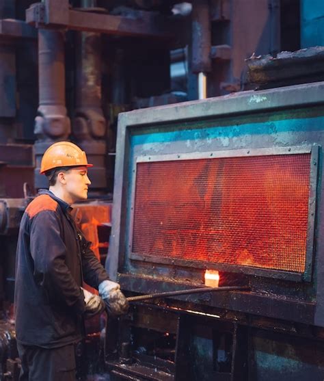 Premium Photo | Workers in the steel mill.