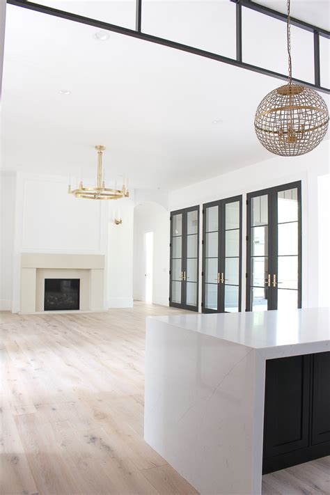 The Forest Modern Living Room Featuring a Gorgeous Cast Stone Limestone Mantel - The House of ...