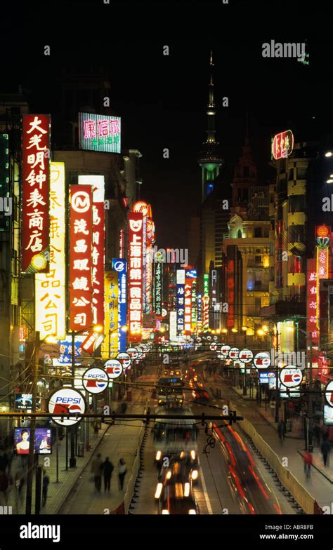 Viewed From Above At Night The Tall Neon Signs And Flashing Lights Of