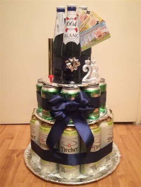 A Cake Made Out Of Beer Cans And Other Items