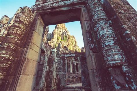 Premium Photo Stone Faces Of Ancient Khmer Culture Temple Of Bayon In