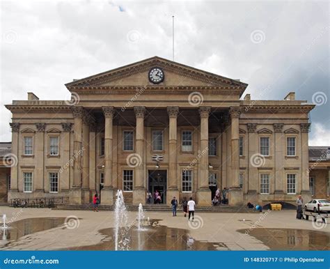 People In Saint Georges Square Huddersfield In Front Of The Facade Of