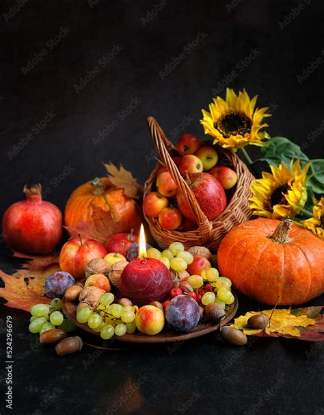 Candle Fresh Fruits Pumpkins Flowers On Abstract Black Background