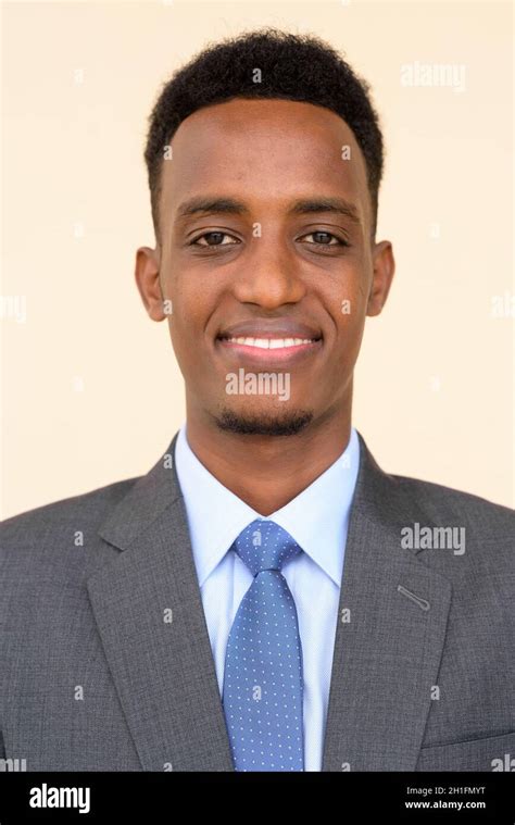 Portrait Of Handsome Young African Businessman Wearing Suit And Tie