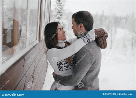 Young Hipster Couple Hugs Each Other in a Winter Park. Winter Holidays ...