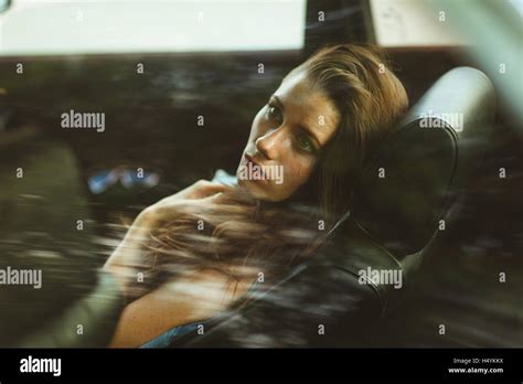 Brunette In The Back Seat Of Car Tinted Photo Stock Photo Alamy