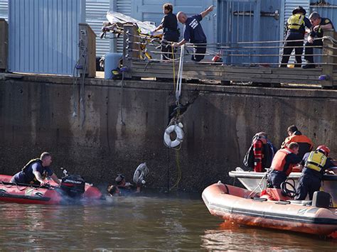 Police Driver Fleeing Crash Dies After Car Plunges Into River