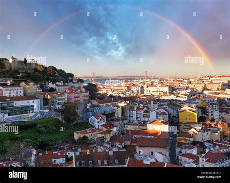 Rainbow Over Lisbon Portugal Skyline With Sao Jorge Castle Stock Photo