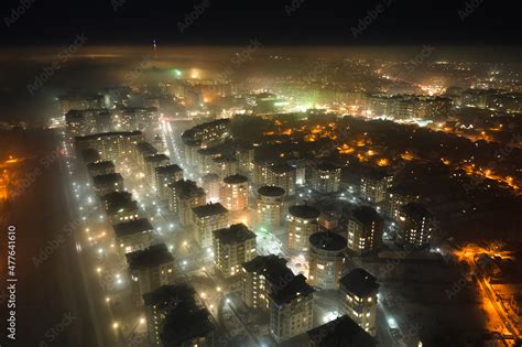 Aerial View Of High Rise Apartment Buildings And Bright Illuminated