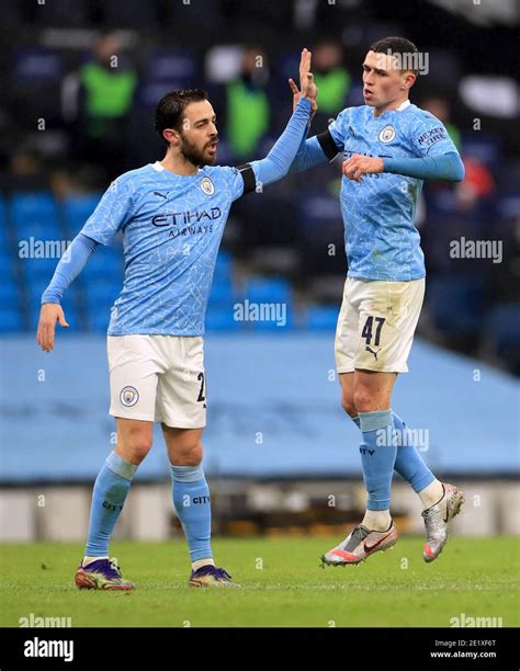 Manchester Citys Phil Foden Right Celebrates Scoring His Sides