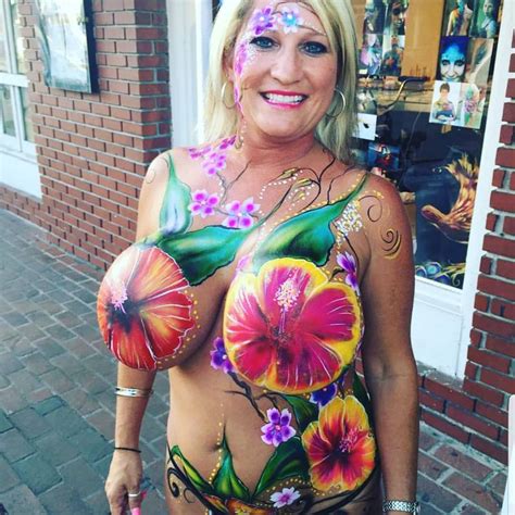 Milf In Body Paint Flaunting Her Huge Hanging Boobs In Public