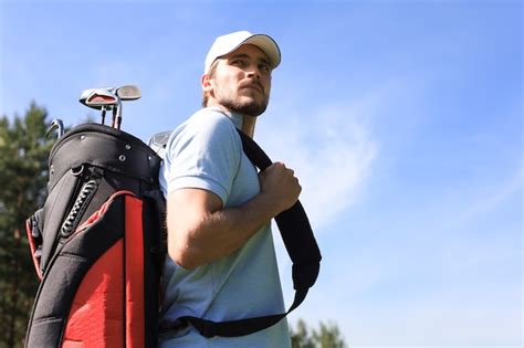 Premium Photo Golf Player Walking And Carrying Bag On Course During