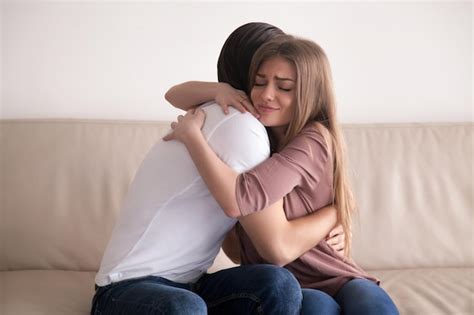 Premium Photo Portrait Of Emotional Young Couple Hugging Each Other