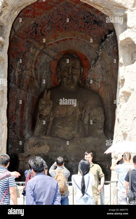 Tourists Visit The Th Cave To View The Stone Amita Buddha Statue