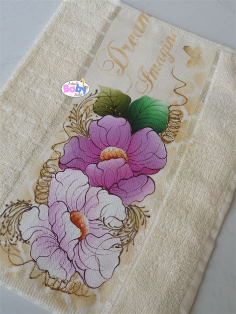 An Embroidered Towel With Flowers On It