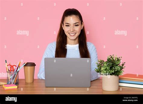 Happy Pretty Brunette Woman Using Computer At Workplace Stock Photo Alamy