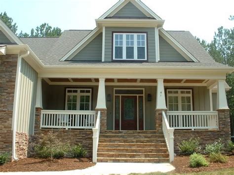 A House With Two Front Porches And Steps Leading Up To It