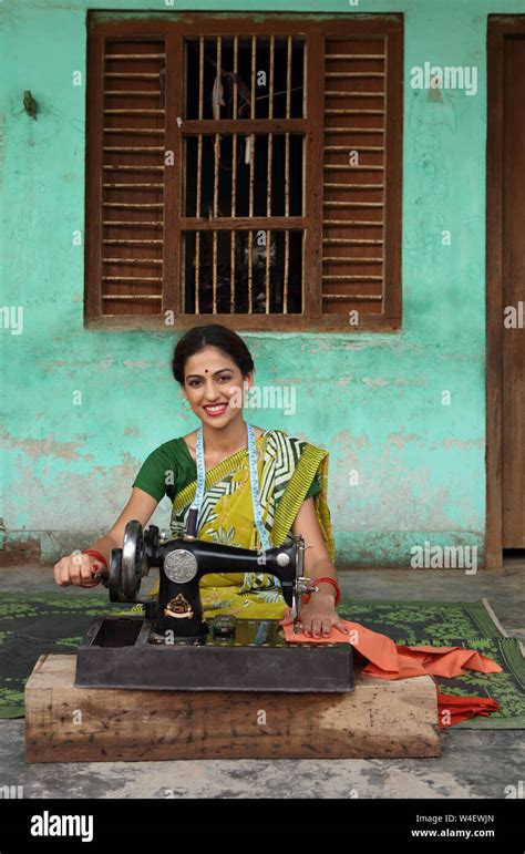 Woman Using Sewing Machine Stock Photo Alamy