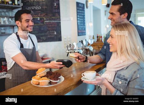 Happy Customers Paying Through Card At Cafe Stock Photo Alamy