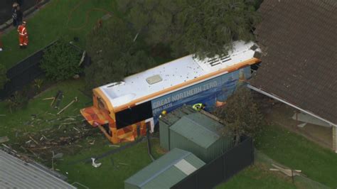 Two People Hospitalised After Bus Crashes Into Houses At Safety Beach