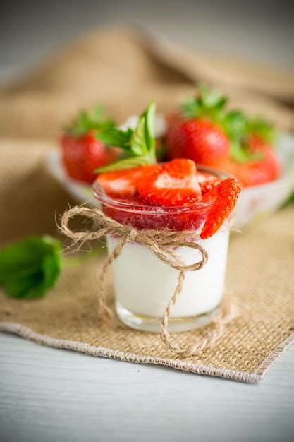 Premium Photo Sweet Homemade Yogurt With Strawberry Jam And Fresh Strawberries In A Glass Cup