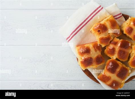 Easter Hot Cross Buns With Colored Eggs Easter Gingerbread Rabbits And Cookies Over White Plank
