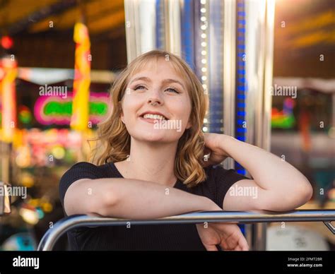 Blonde Spanish Woman Posing In The Amusement Park Stock Photo Alamy