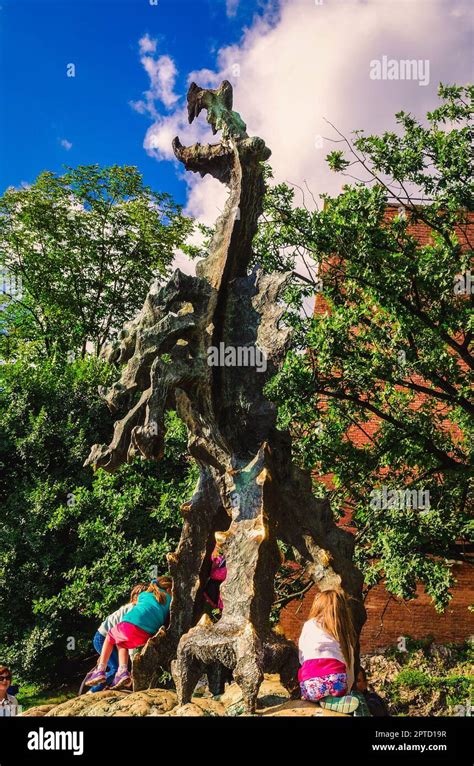 Krakow, Poland - August 16, 2014: Tourists visiting the statue of Wawel ...