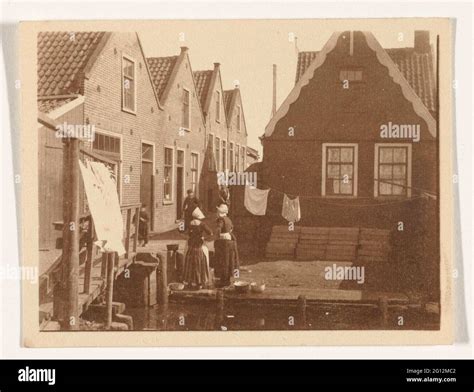 Figures on the street in traditional costume in Volendam Stock Photo ...