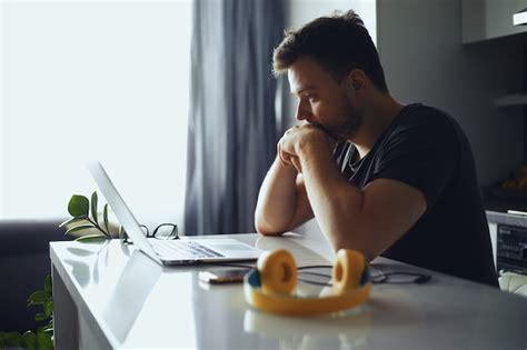 Premium Photo Man Lost In Thoughts In Front Of Laptop Male Thinking