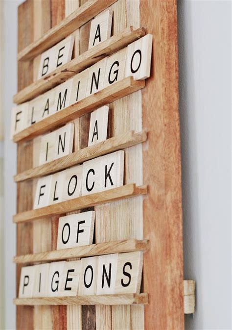 Scrabble Tiles Spelling Out The Names Of Different Places On A Wooden