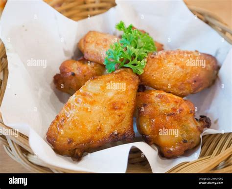 Hot And Spicy Chicken Wings In Basket Stock Photo Alamy