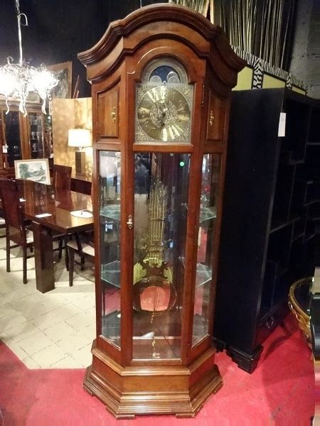 Howard Miller Grandfather Clock With Curio Cabinets