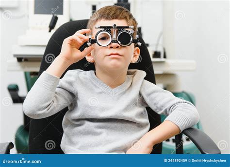 Cheerful Child Boy In Glasses Checks Eye Vision Pediatric