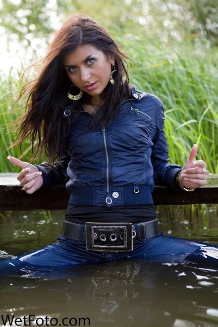 Wetlook By Beautiful Girl In Jacket Tight Jeans On Shoes With Heels By The River