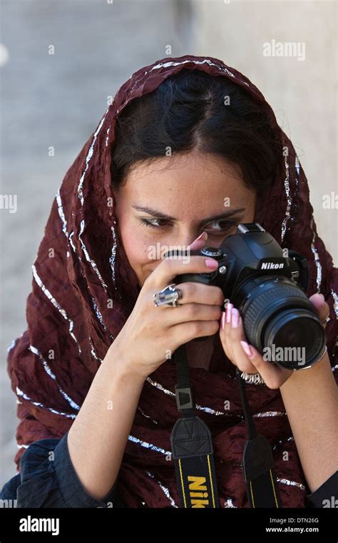 Young modern Afghan woman taking photographs in Kabul Afghanistan Stock ...