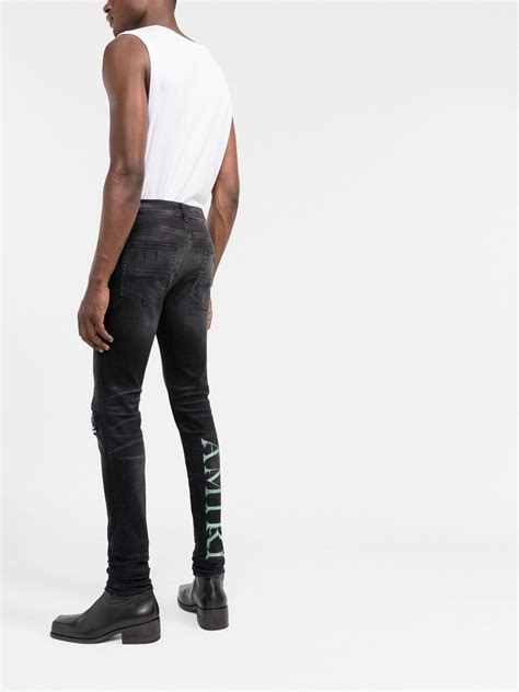 Amiri Ripped Detail Skinny Jeans In Black Modesens