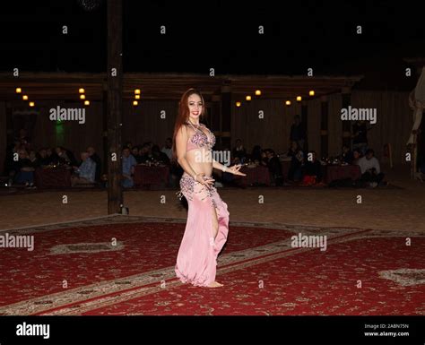 A Belly Dancer Performs During An Arabian Adventures Desert Safari In