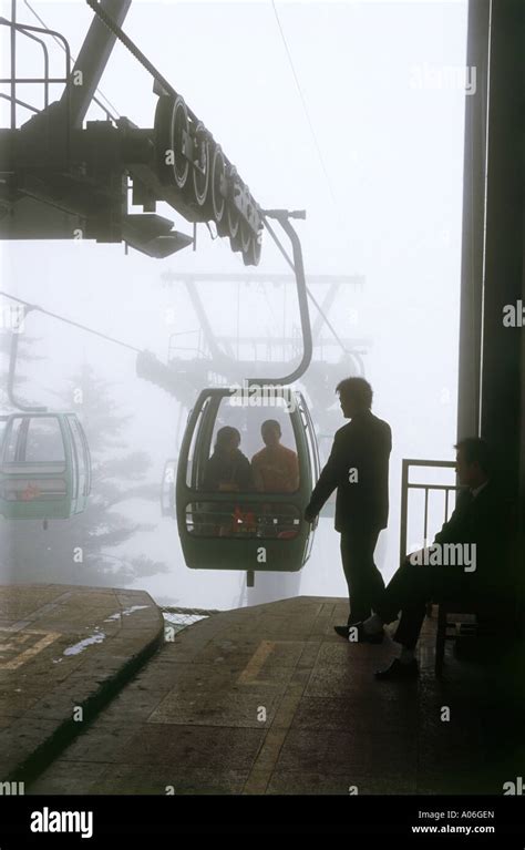 Cable Car Emerges From Cloud At Emeishan One Of China S Four Holy