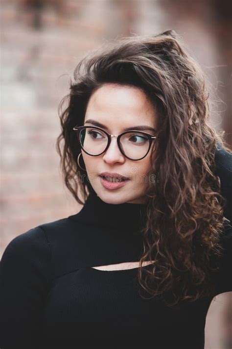 Beautiful Young Woman With Brunette Curly Hair Portrait In Eye Glasses Enjoying The Sun Stock