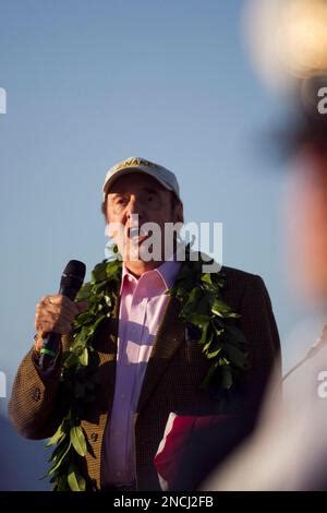 Jim Nabors sings the national anthem at the beginning of a ceremony ...