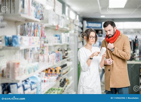 Pharmacist With Client In The Pharmacy Store Stock Photo Image Of