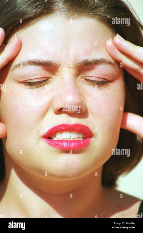 Woman with headache Stock Photo - Alamy