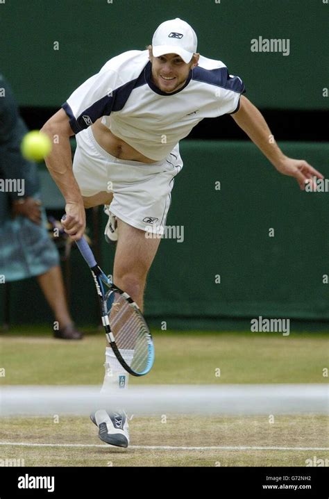 Andy Roddick From The Usa Hits Another Mph Serve To Roger Federer