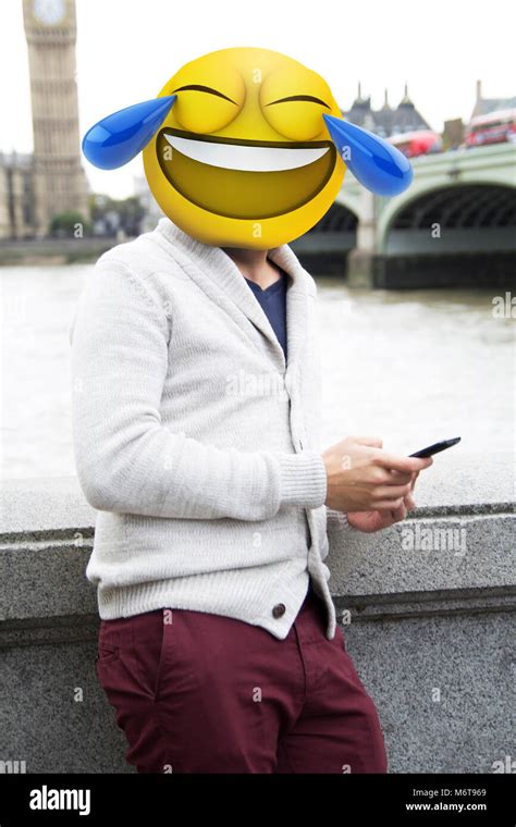 man with emoji head laughing Stock Photo - Alamy