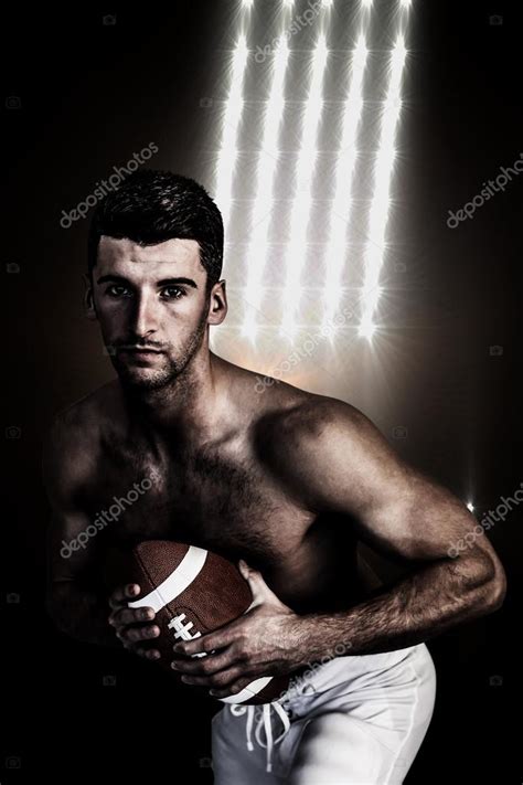 Shirtless Rugby Player Posing With The Ball Stock Photo By