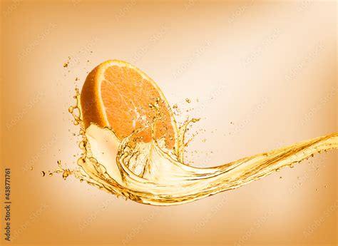 Splashing orange juice with orange slice on colored background Stock ...