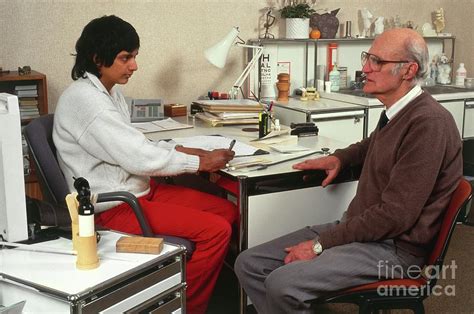 Doctor Writing A Prescription For An Elderly Man Photograph By Chris Priest And Mark Clarke