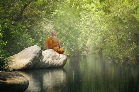 Buddhist Monk In Meditation At Beautiful Sunset Or Sunrise Background ...