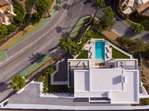 an aerial view of a house with a swimming pool